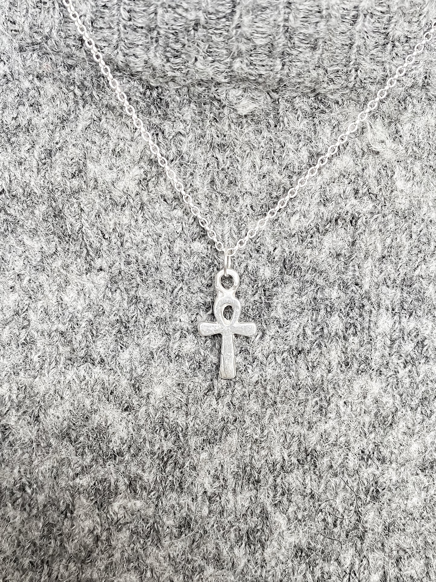 Ankh Pendant layered over textured grey knit, silver or gold. Egyptian African