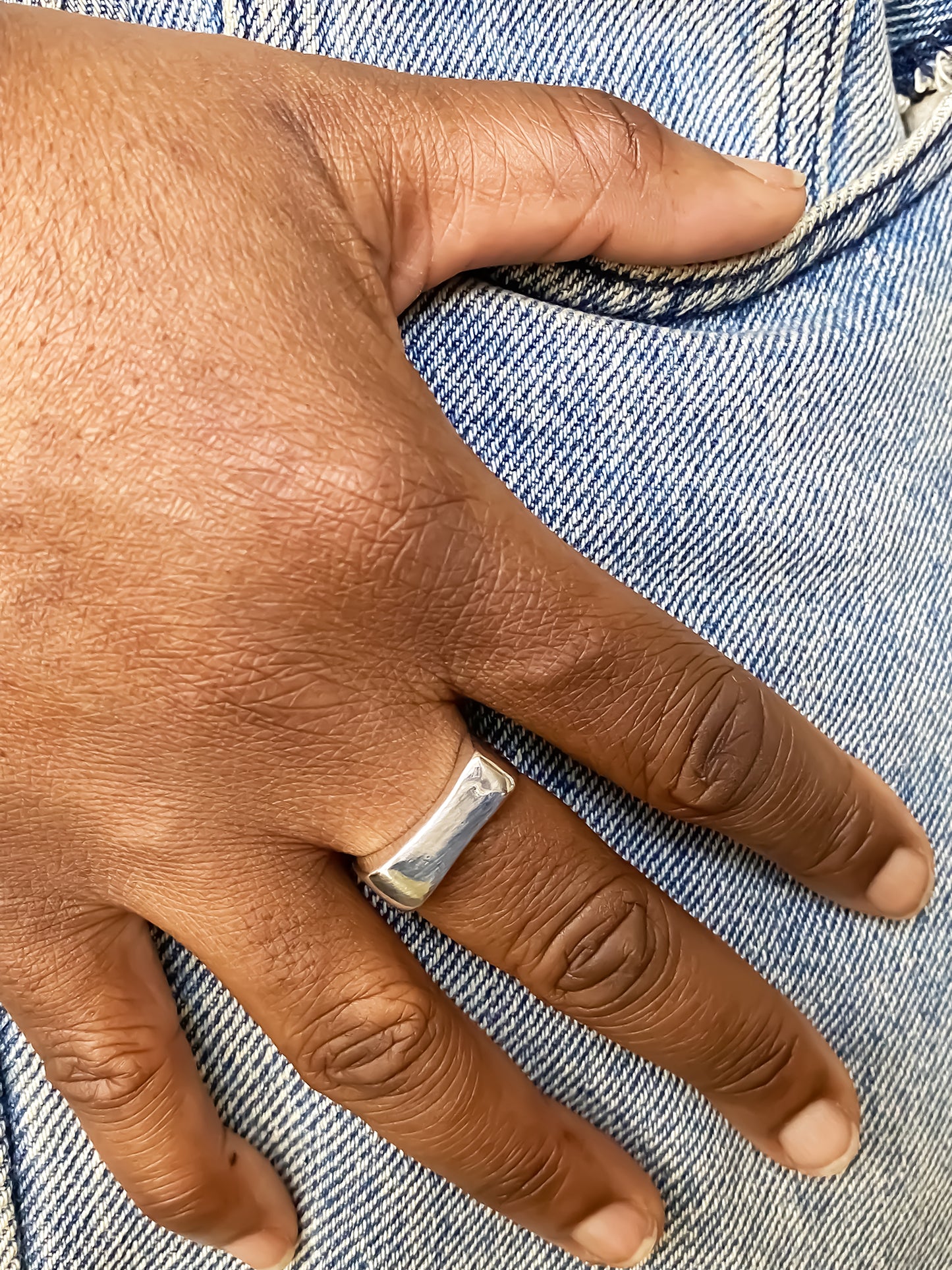 Asymmetric Grace Bow Ring unique gold and silver rings free shipping worn on a hand with denim jeans