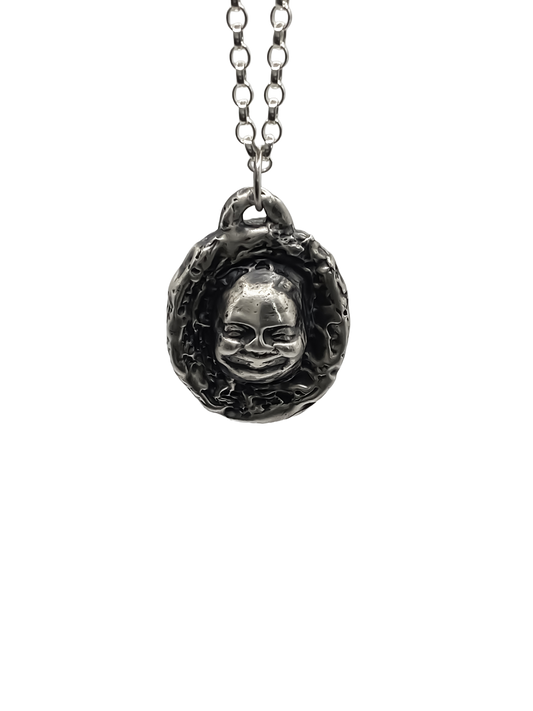 Flat studio image of Buddha Face Pendant in silver - happy buddha, spiritual, oxidised organic texture gold or silver free shipping
