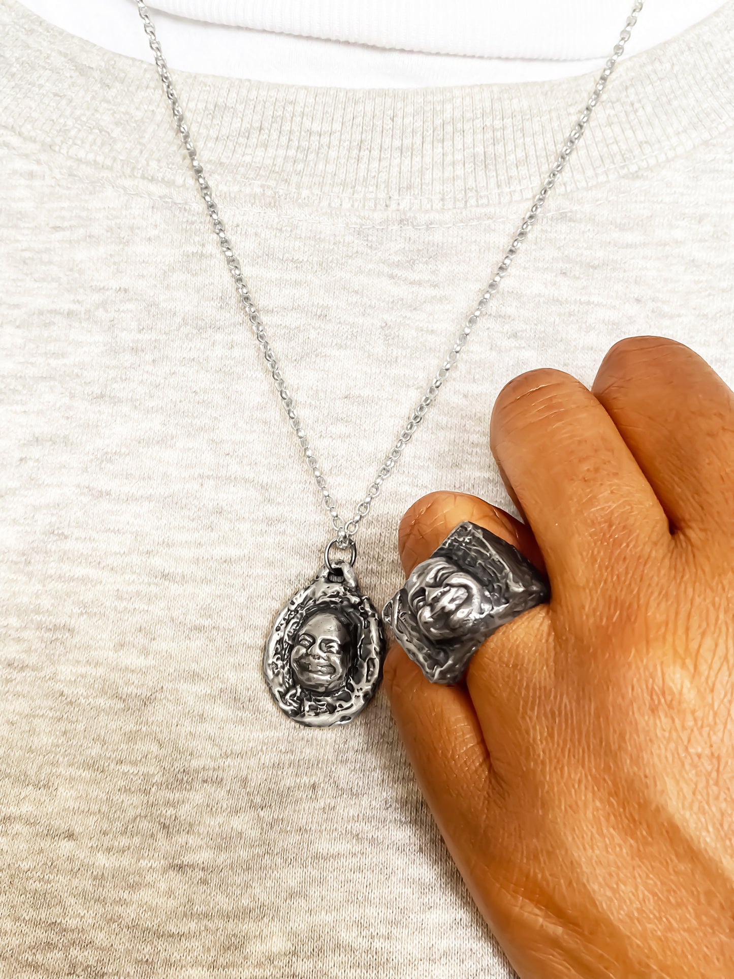Buddha Signet Ring styled next to pendant on cloth - peaceful statement piece, oxidised gold or silver, free shipping