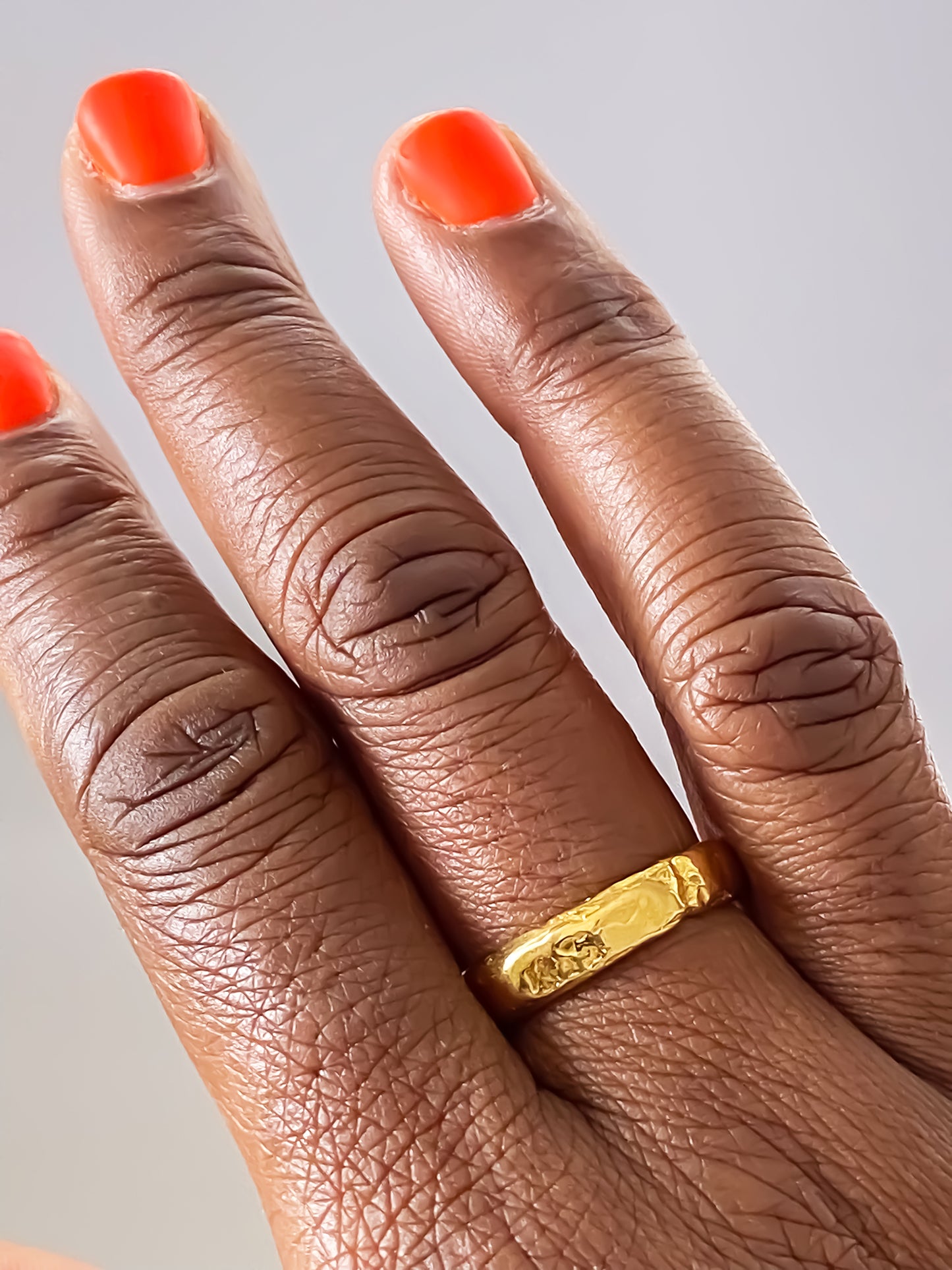 Fine gold band ring with organic hammered detail from MOCA Jewellery's Darling collection.