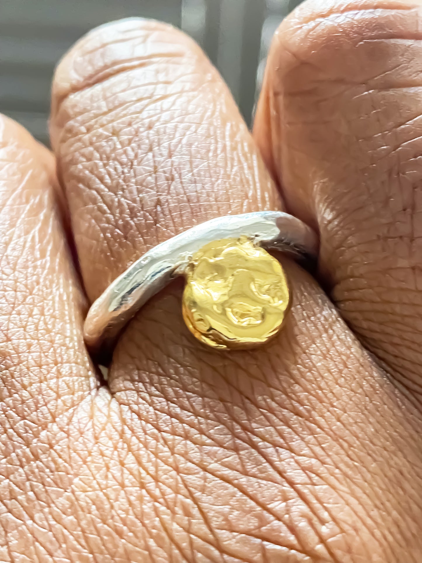 Sleek handmade accent ring with gold circle texture by MOCA Jewellery, minimalist design
