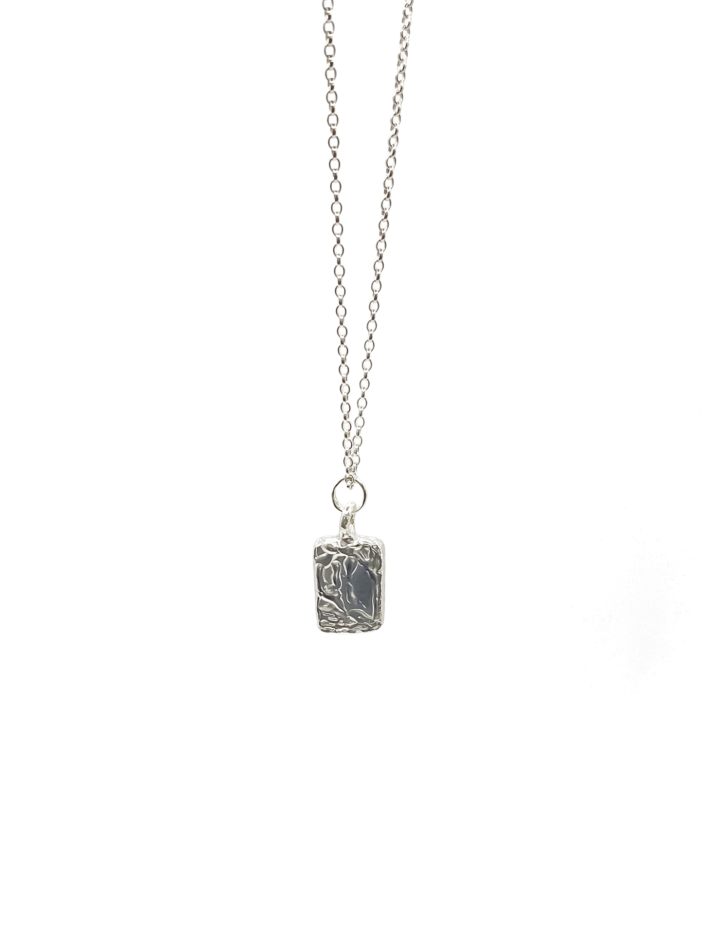 Minimal rectangular sculpted pendant hanging from chain, sleek textured silver or gold with delicate details and free shipping