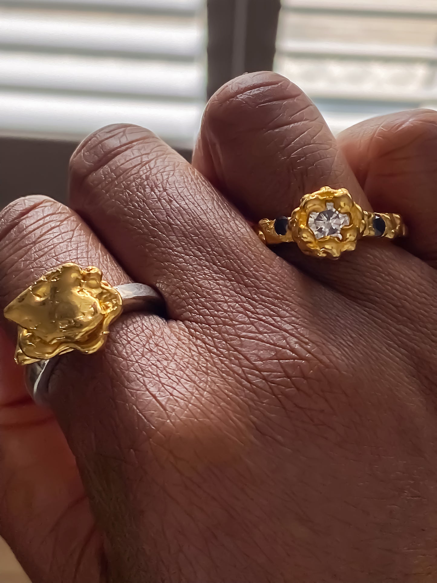 Textured gold ring set with sculptural form and gemstone accents, MOCA Jewellery exclusive.