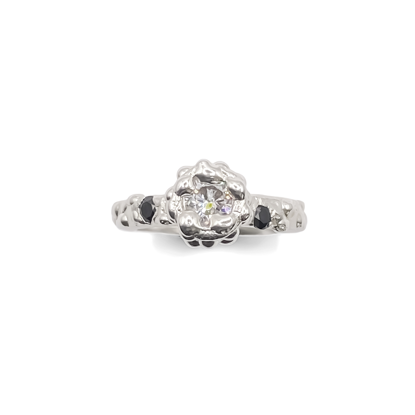 Flatlay of Orbit Ring with full dotted band visible - abstract, bold white and black gemstones gold or silver free shipping