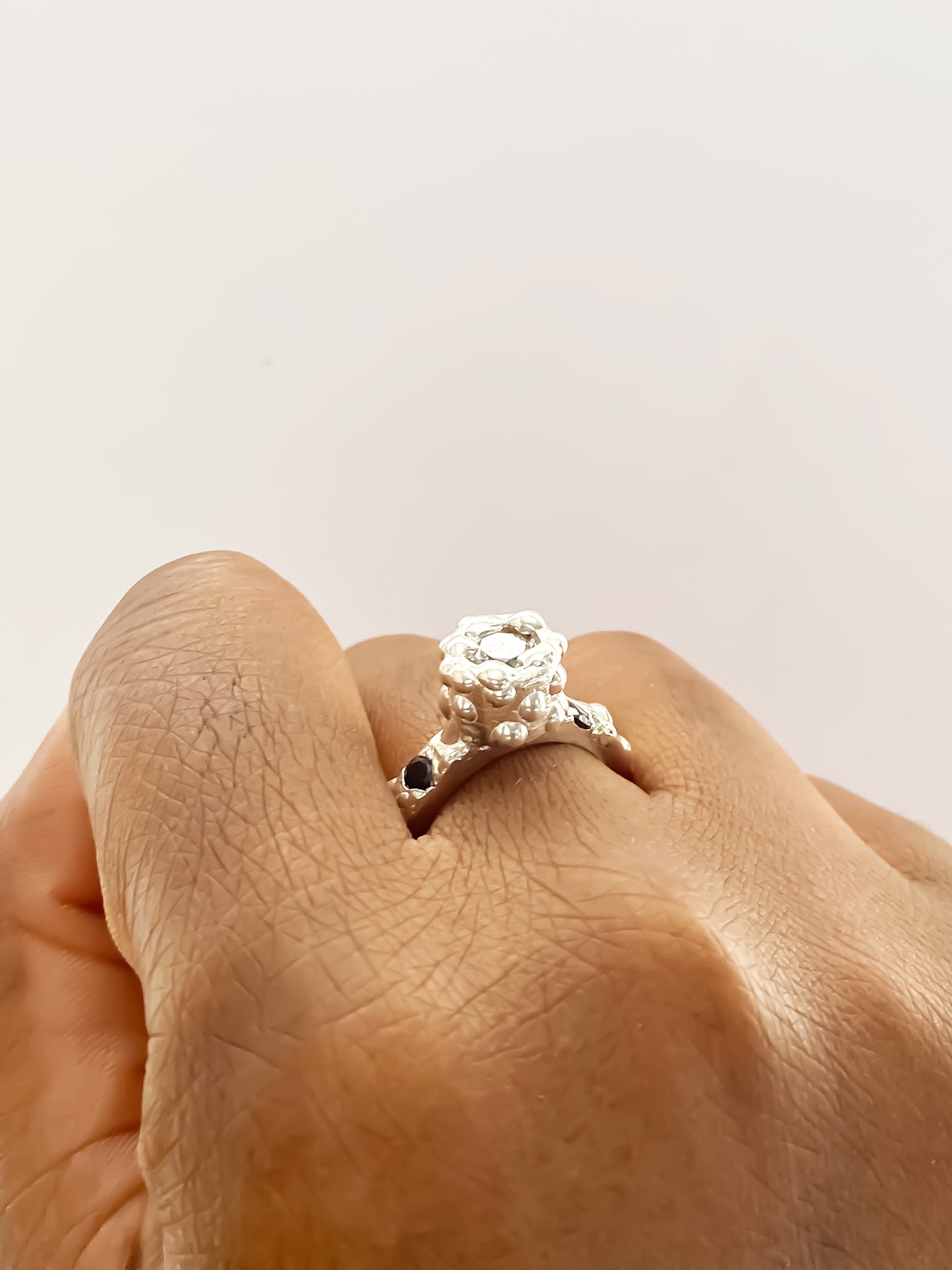 Silver Orbit Ring worn on hand close-up - abstract, bold white and black gemstones gold or silver free shipping