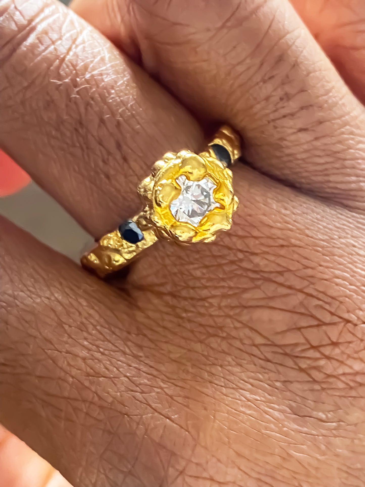 MOCA Jewellery handmade Orbit Ring with abstract dotted band and contrasting white and black gemstones in gold finish