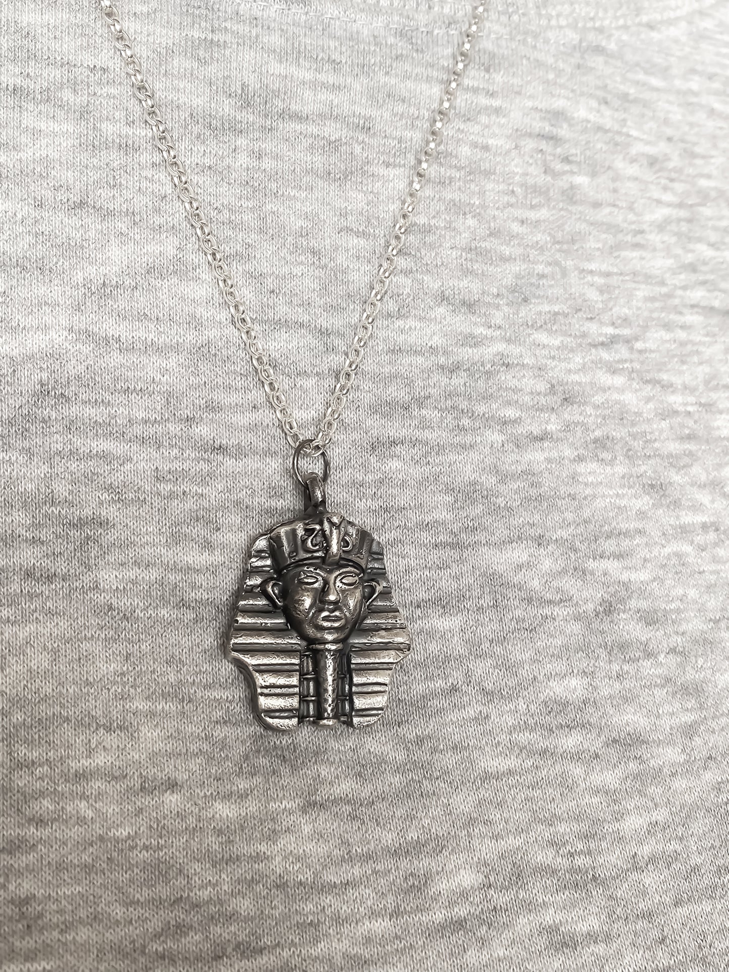 Pharaoh Pendant styled on grey background - oxidised Egyptian African gold or silver free shipping
