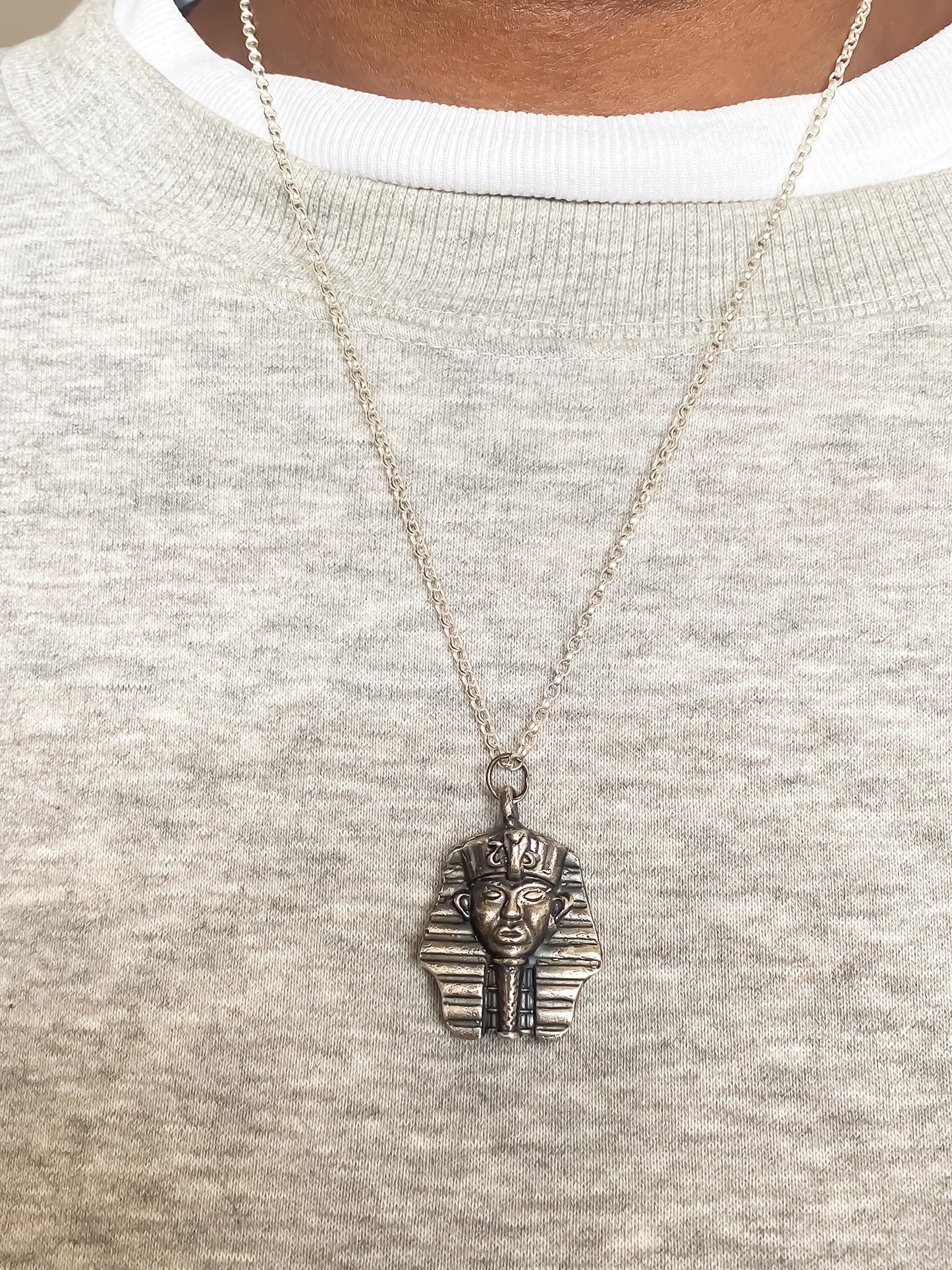 Pharaoh Pendant worn on chest close-up - oxidised Egyptian African gold or silver free shipping