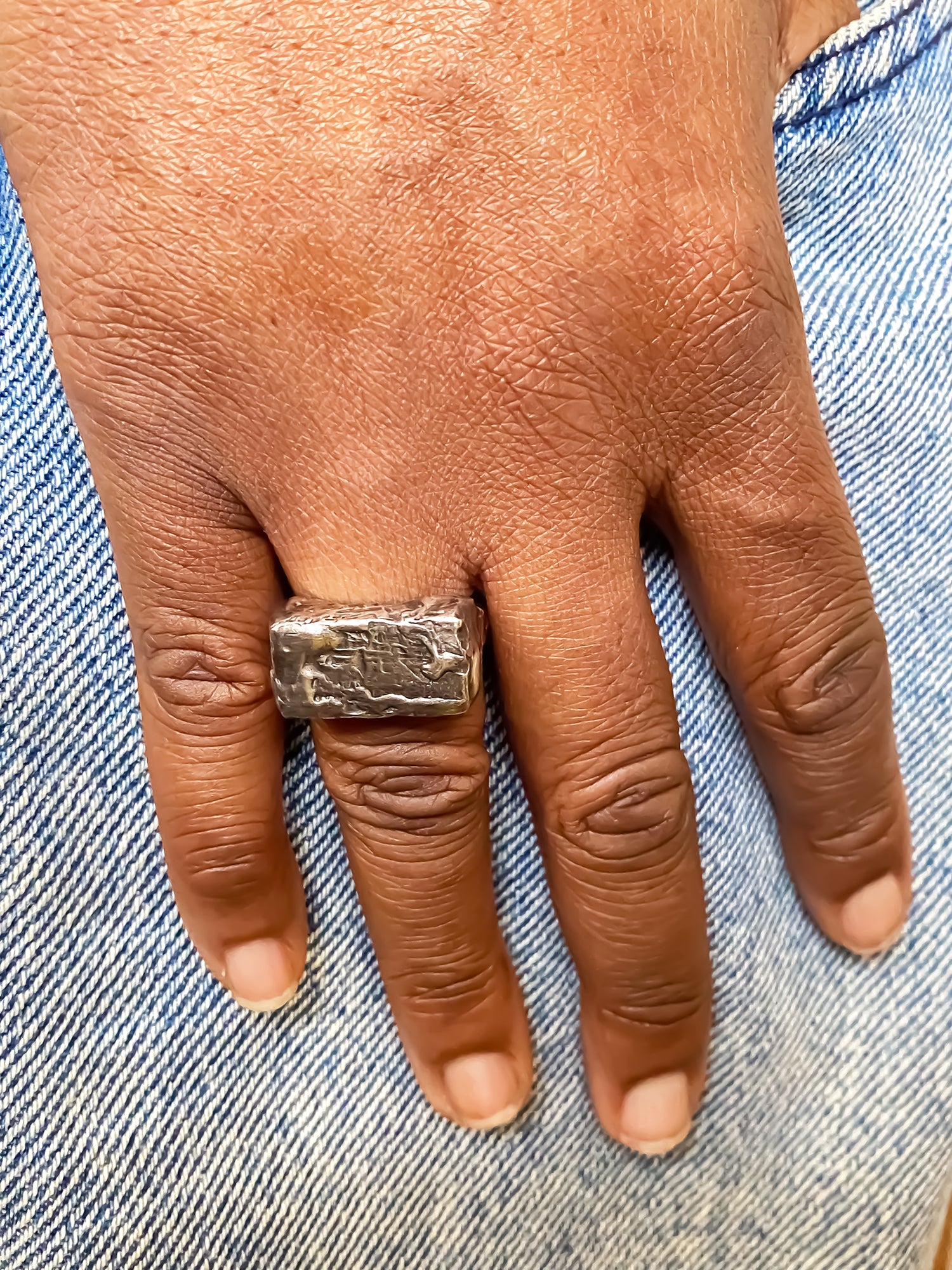 Rippled Signet Ring in oxidised textured gold or silver with free shipping displayed on a hand