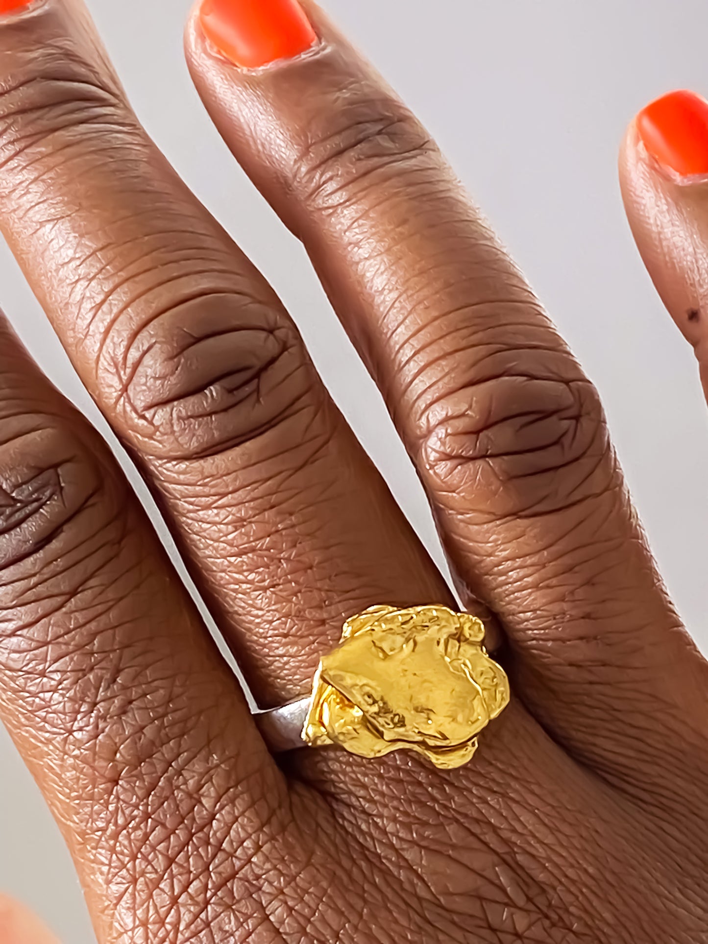 Sculptural flower ring handmade in gold by MOCA Jewellery, a nature-inspired statement accessory with free UK shipping