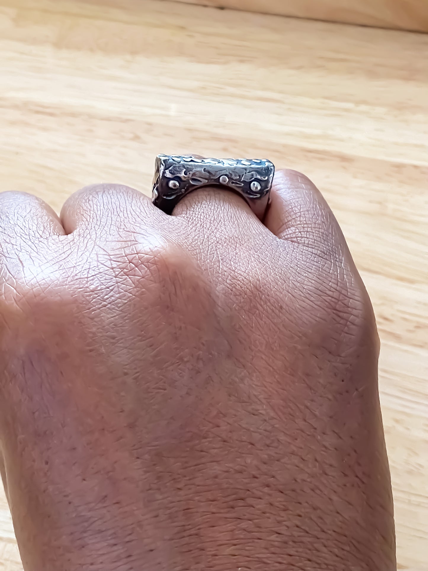 Hand wearing a Slender unique Textured Ring oxidised gold or silver free shipping showcasing its unique design