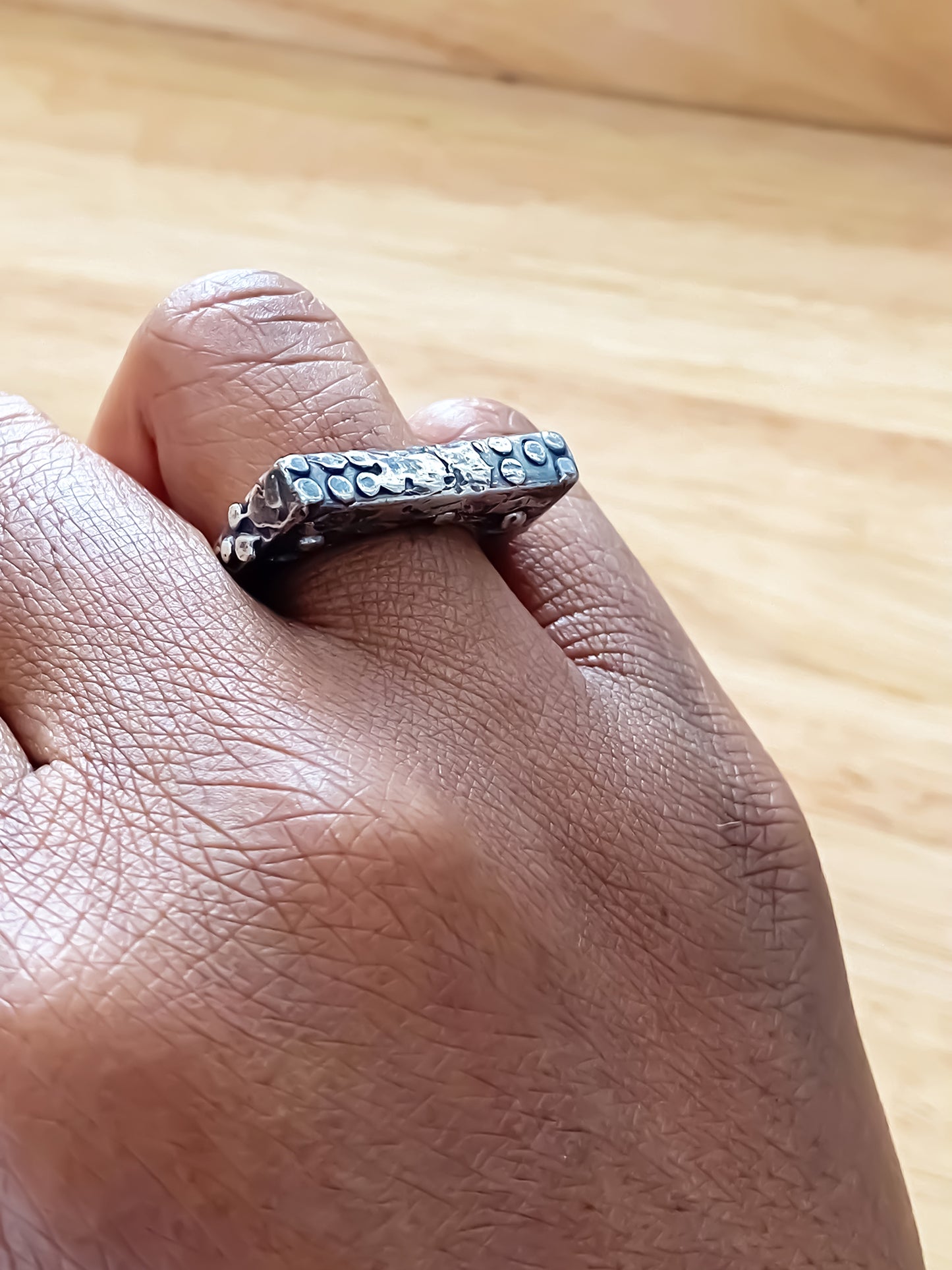Slender unique Textured Ring oxidised gold or silver free shipping displayed on a hand