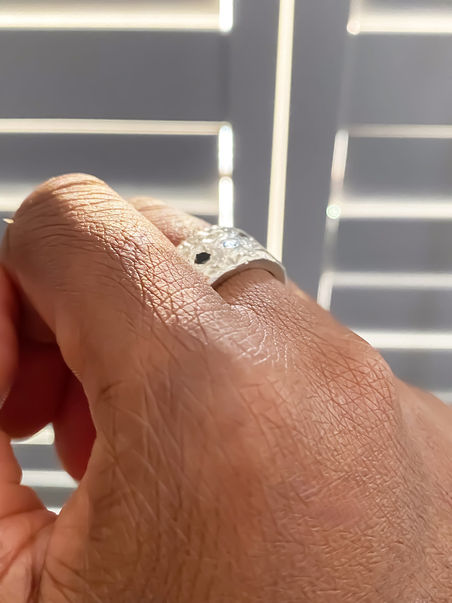 Hand gesture showing off the Stone Set Band in silver - textured band white and black gemstones gold or silver free shipping