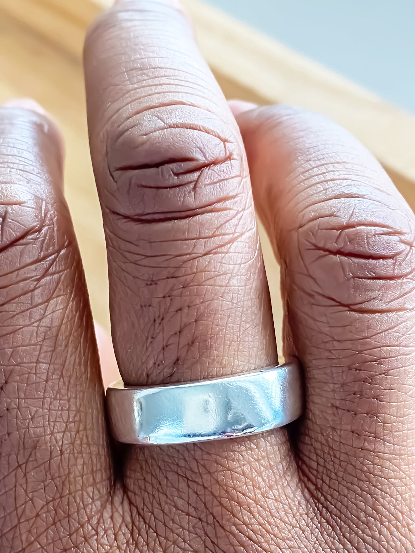Close-up of Thickems Band Ring on finger statement bold gold or silver free shipping