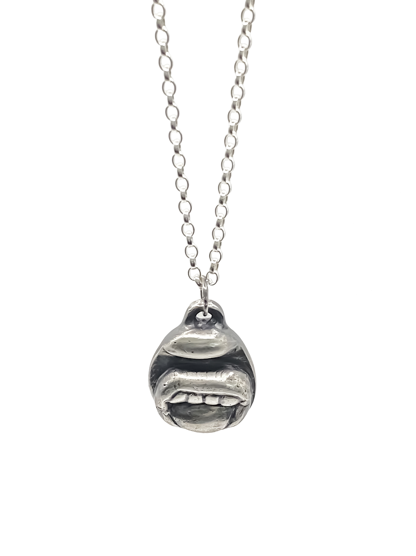 Tongue & Teeth Pendant shown hanging front-facing - tongue smile mouth lips charming oxidised organic texture gold or silver free shipping