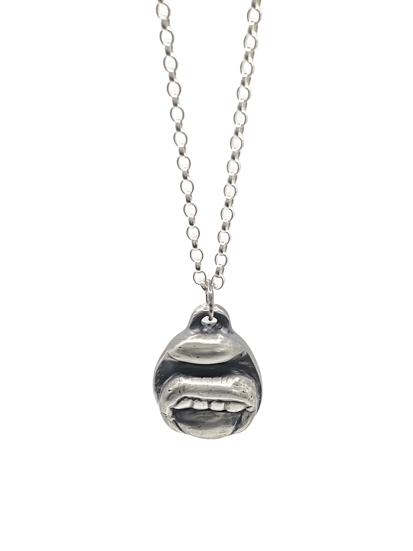 Close-up of Tongue & Teeth Pendant texture and lips - tongue smile mouth lips charming oxidised organic texture gold or silver free shipping
