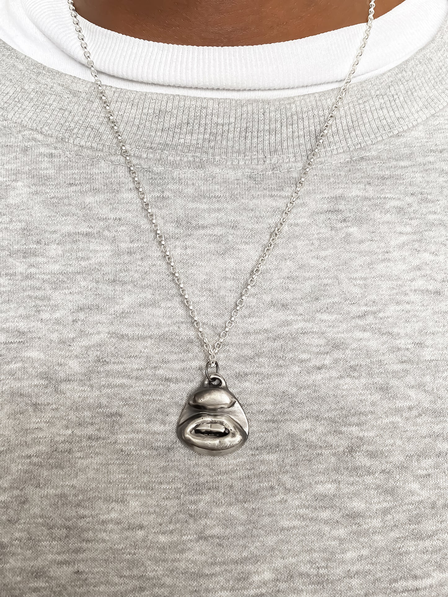 Two Teeth Pendant styled on chest centre - smile mouth lips charming oxidised organic texture gold or silver free shipping