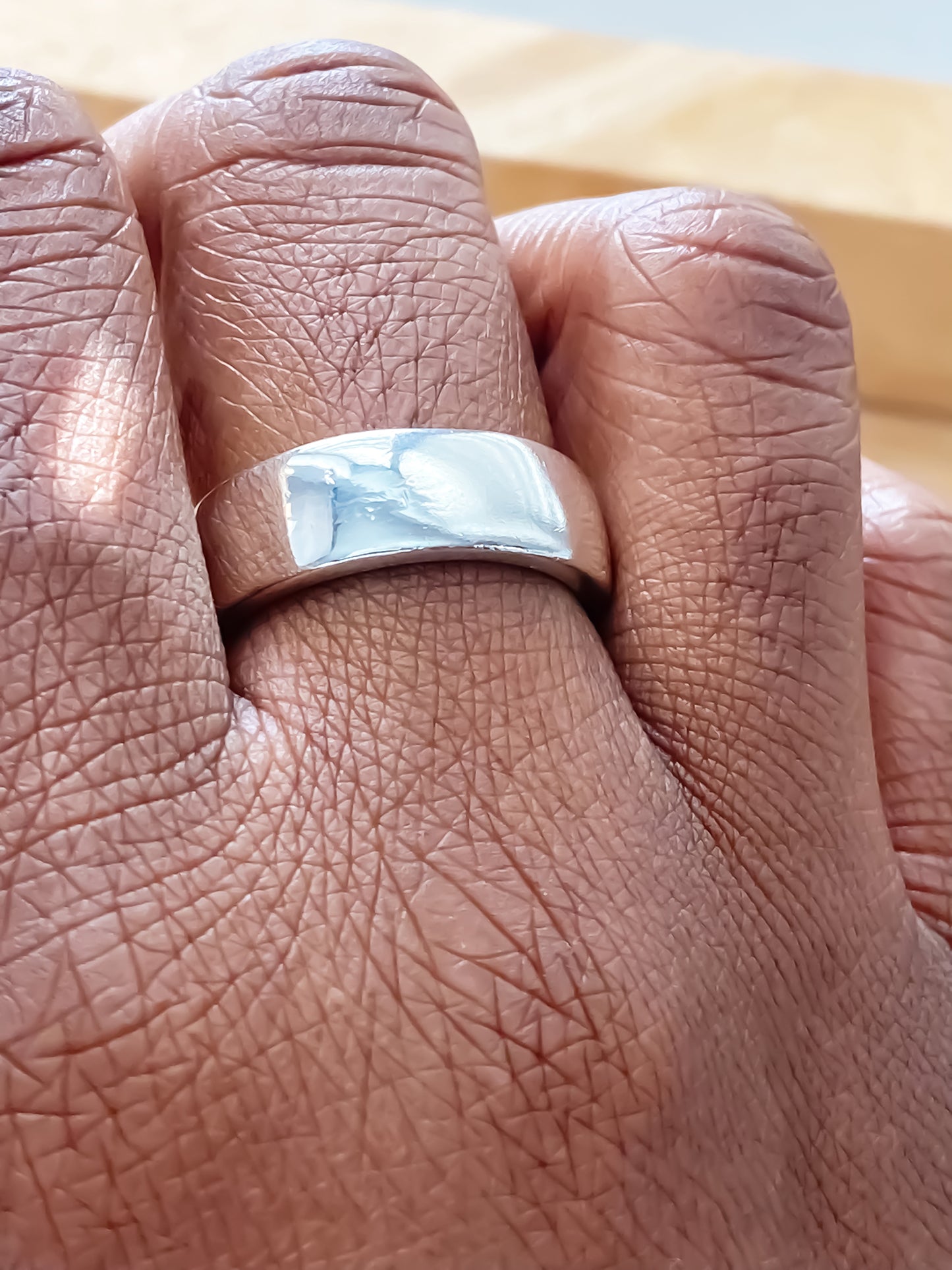 Close-up of Wide Band Ring with soft polished finish - unisex, subtle wedding band bold gold or silver free shipping