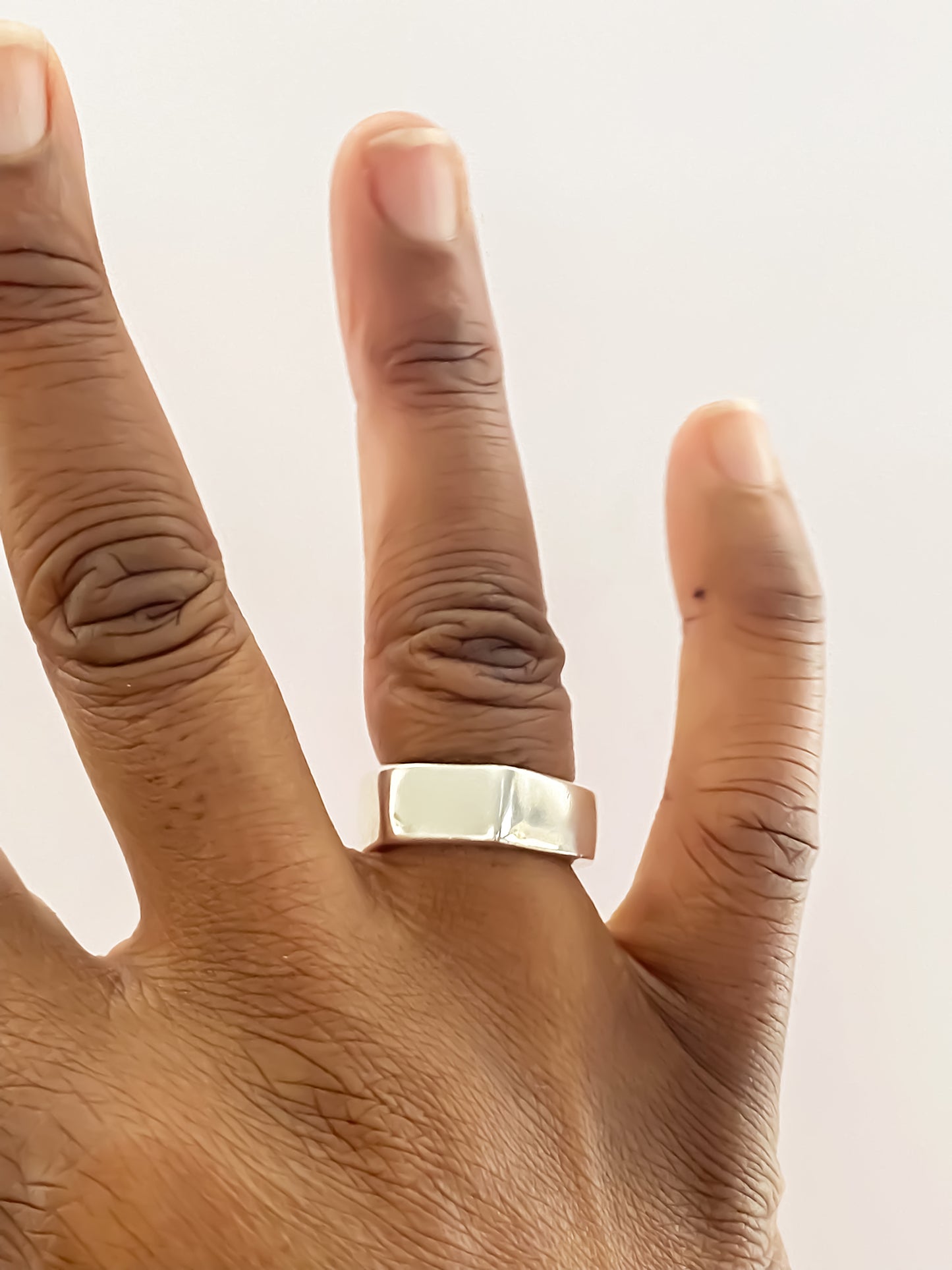 Close-up of Wonky Nut Ring worn on hand - playfully unique elegant gold or silver free shipping