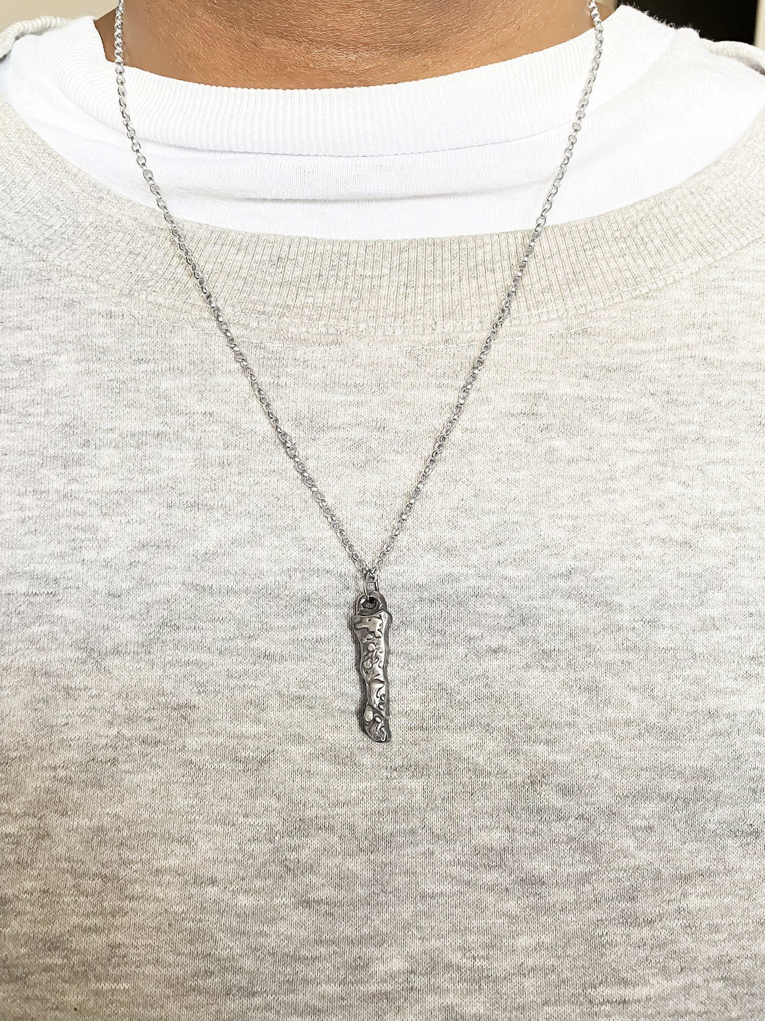 Brand Pendant worn by model in soft light - textured, square happy buddha, oxidised organic texture gold or silver free shipping