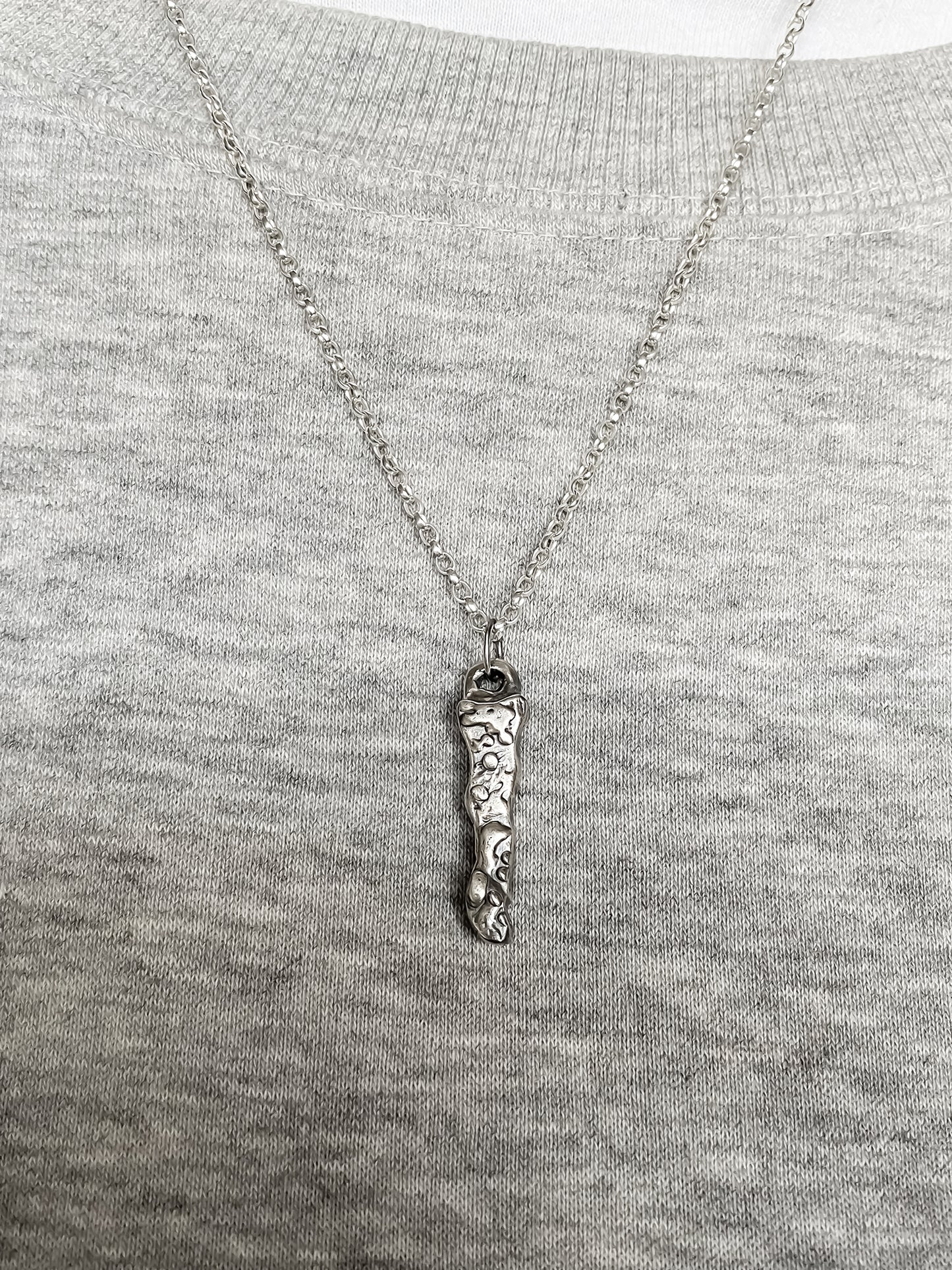 Brand Pendant worn by model in soft light - textured, square happy buddha, oxidised organic texture gold or silver free shipping
