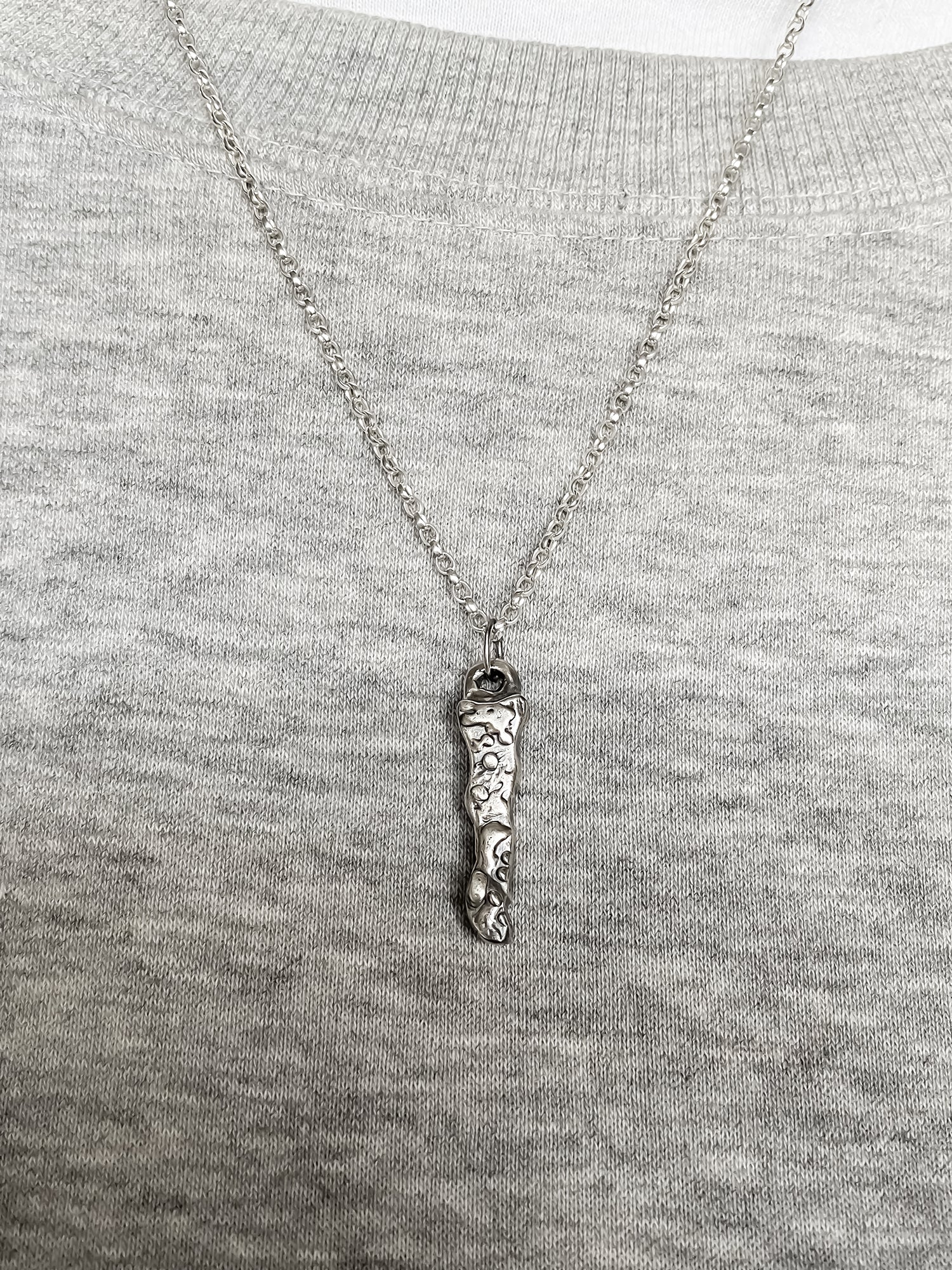 Brand Pendant worn by model in soft light - textured, square happy buddha, oxidised organic texture gold or silver free shipping