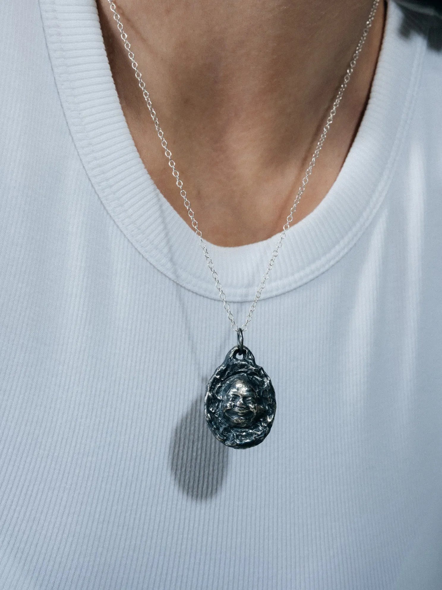 Buddha Face Necklace luxury artisan necklace in premium metal, meditative piece, styled view