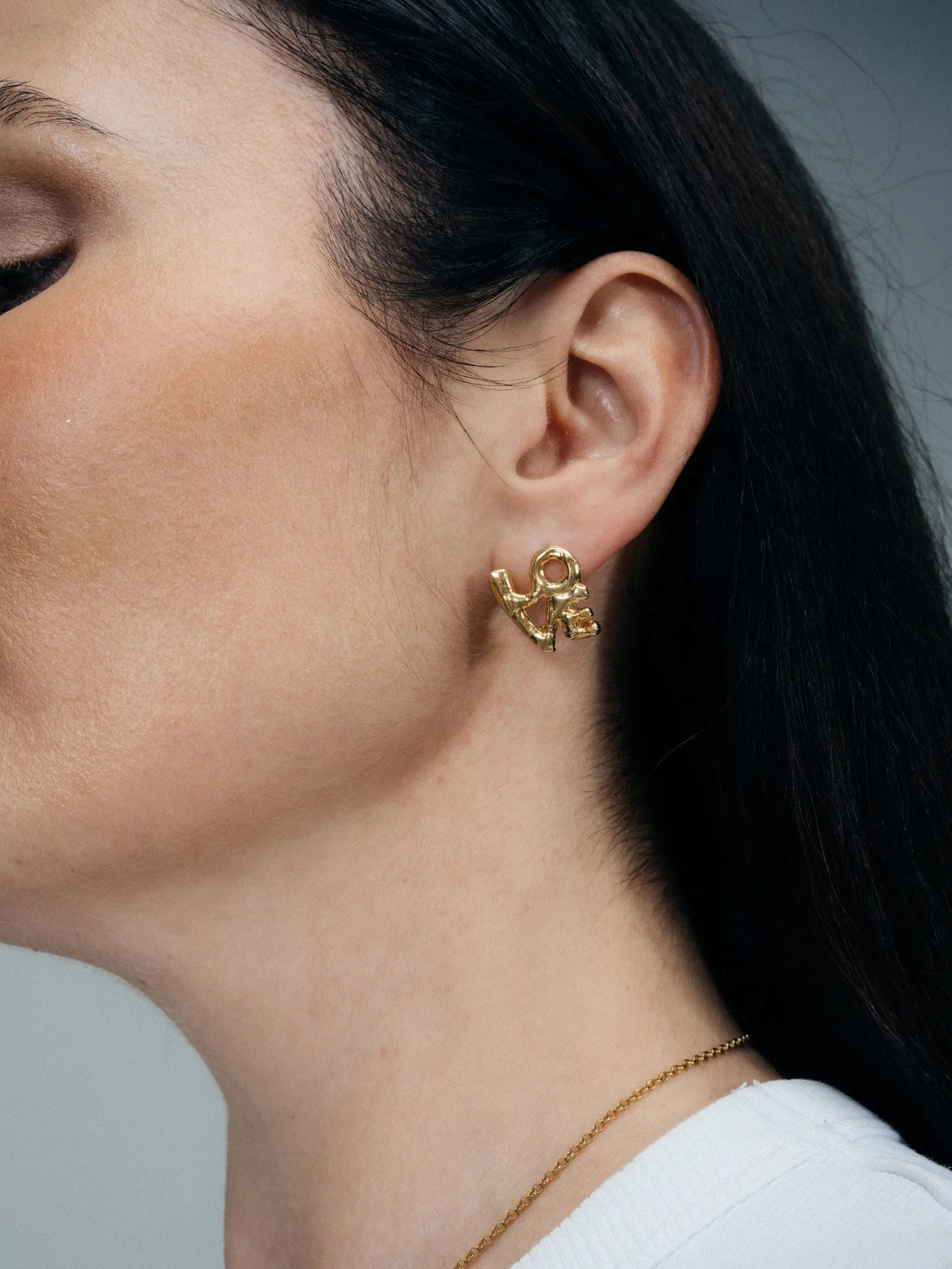 Fuck/Love Earrings artisan crafted ring in premium metal, timeless style, lifestyle shot