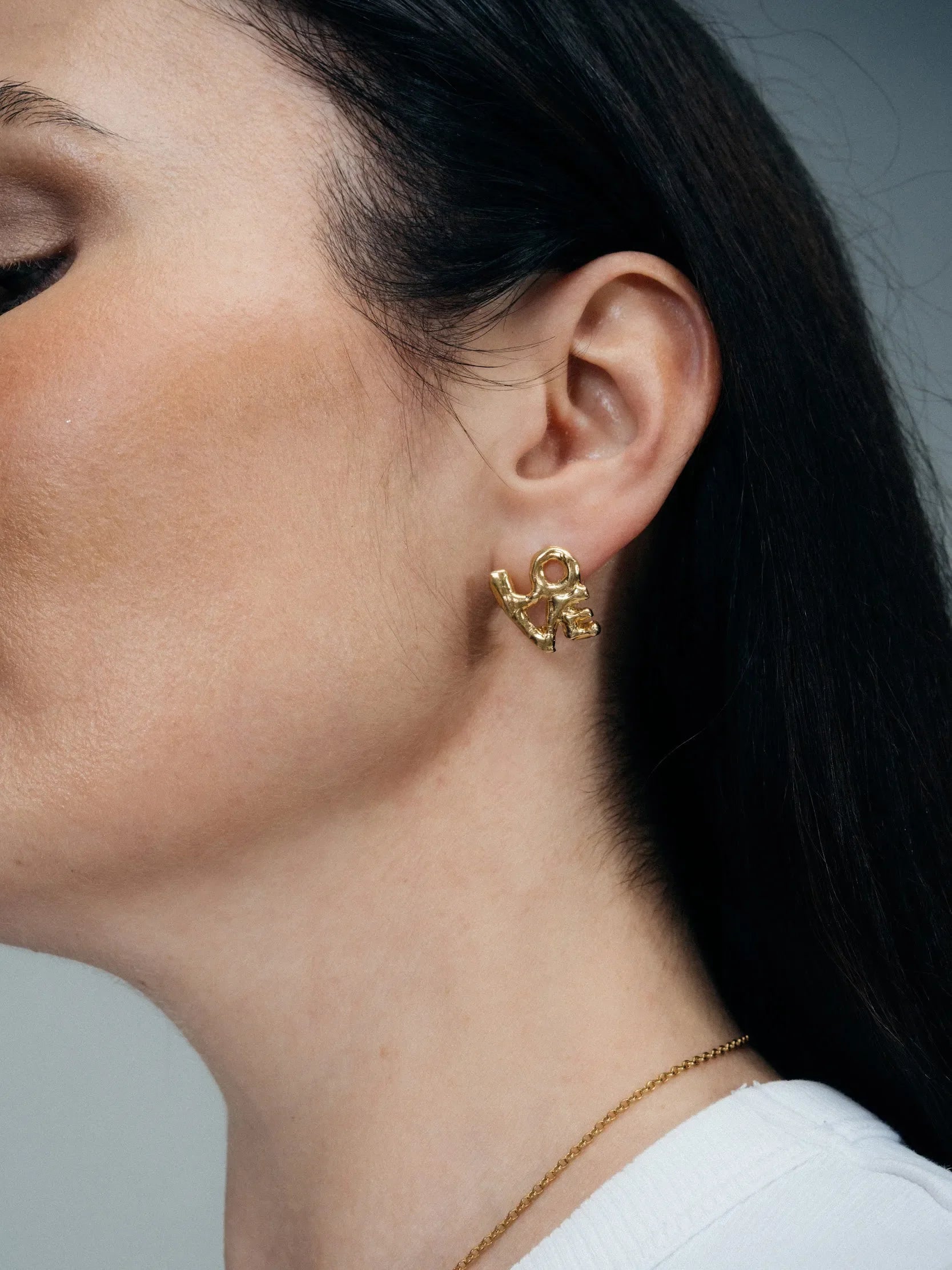 Fuck/Love Earrings artisan crafted ring in premium metal, timeless style, lifestyle shot