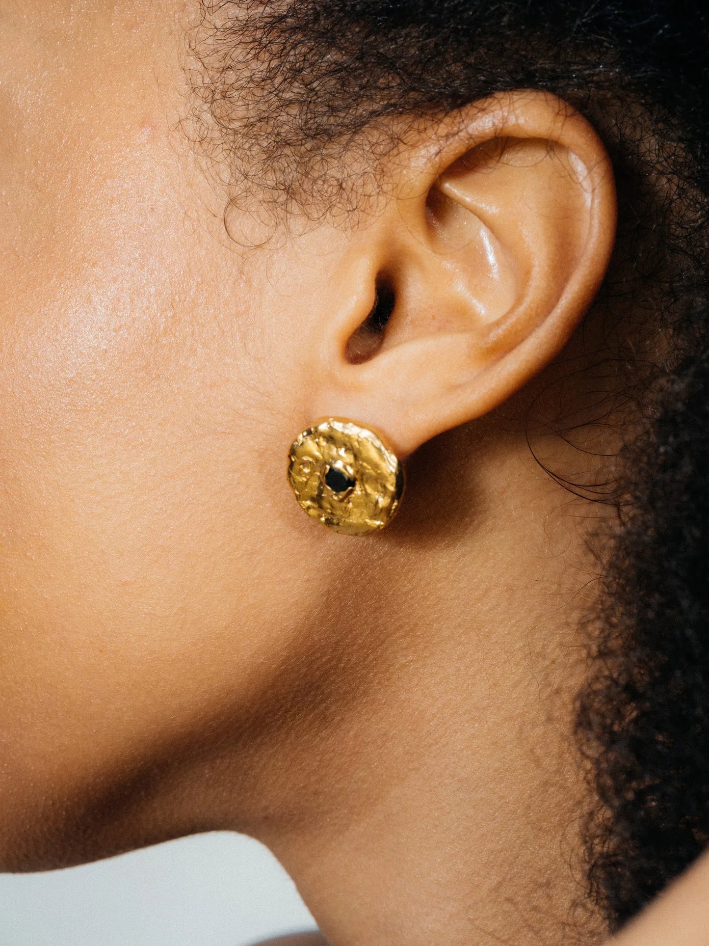 Artisan Grain Circle Gem Stud Earring in premium premium metal, refined finish, angle view