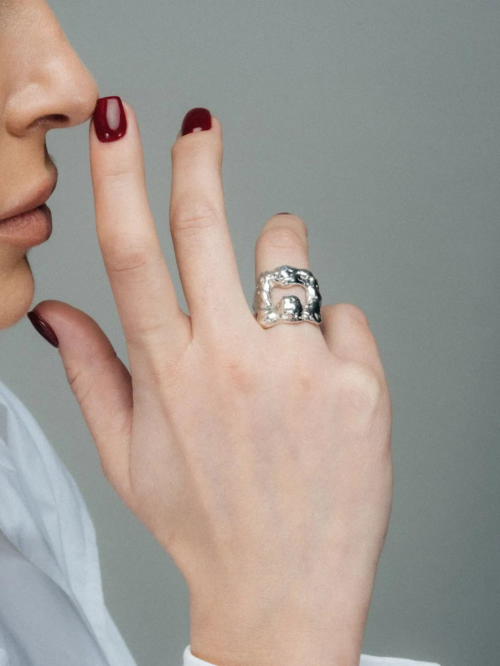 Artisan Mask Ring in premium premium metal, refined finish, angle view