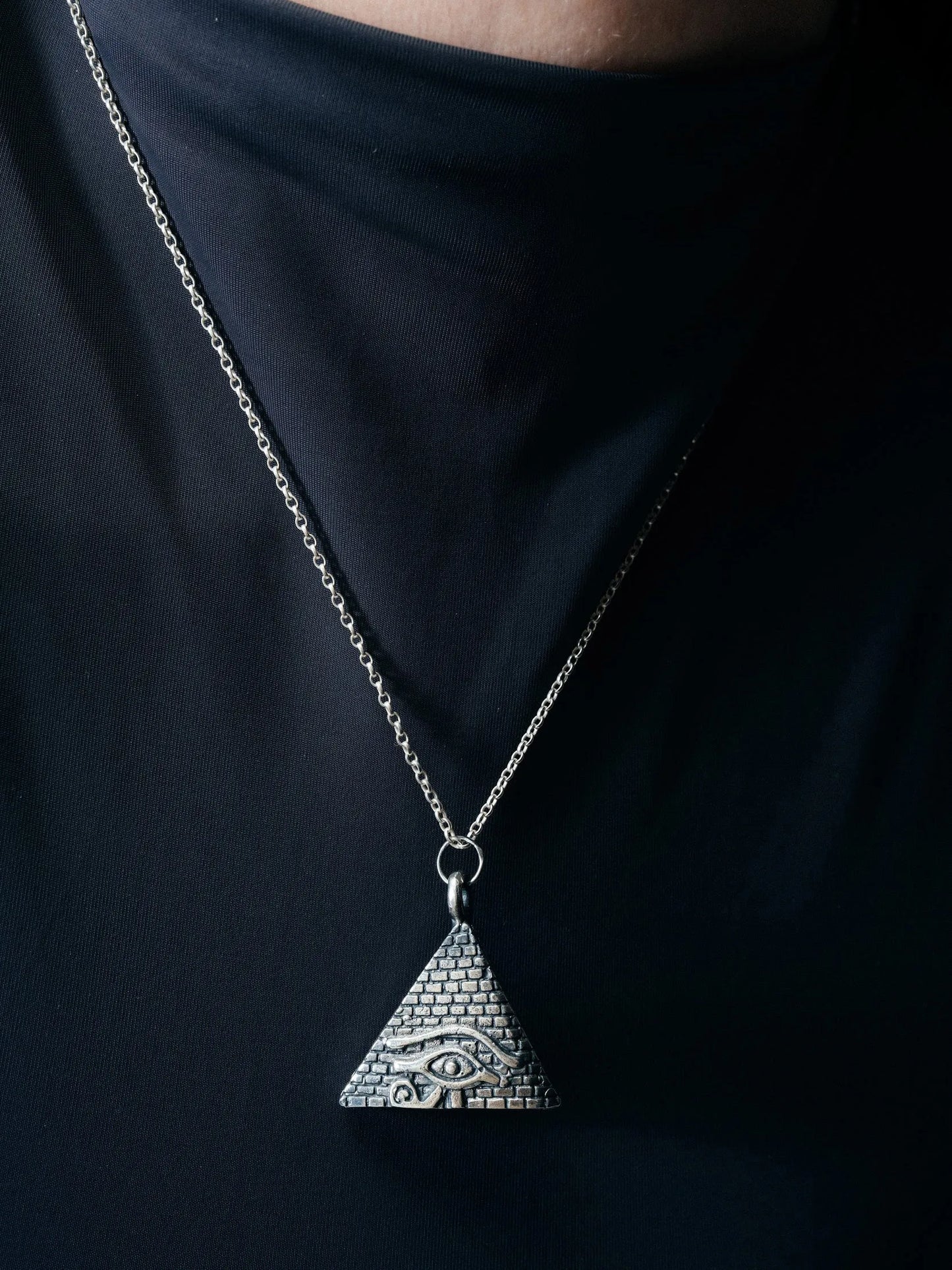 Artisan Horus Eye Pyramid Necklace in premium premium metal, refined finish, angle view