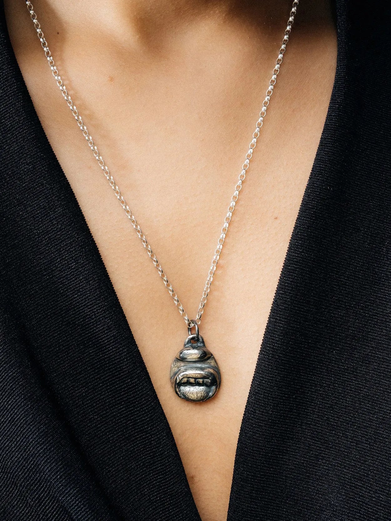 Artisan Tongue & Teeth Necklace in premium Patina, refined finish, angle view