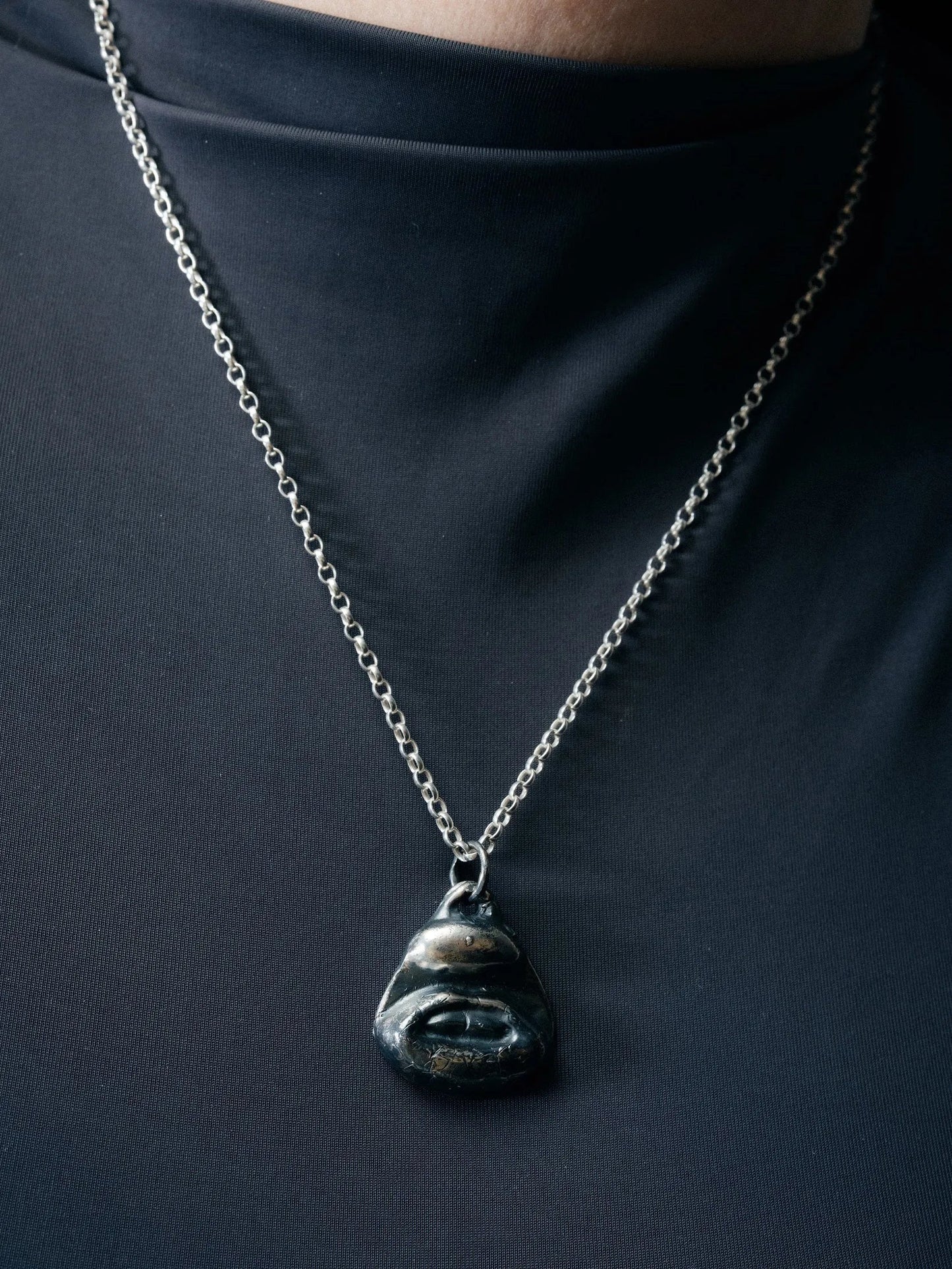 Artisan Two Teeth Necklace in premium premium metal, refined finish, angle view