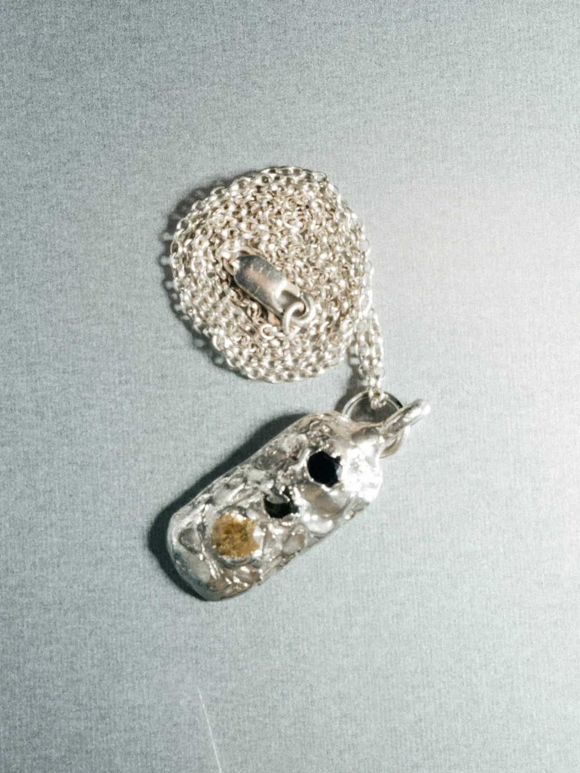 Designer Chi Pendant in premium metal, handmade jewelry, exquisite detail, alternate angle