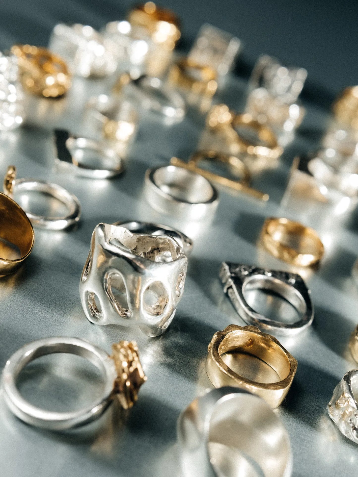 Artisan "Flower" ring in premium premium metal, refined finish, angle view