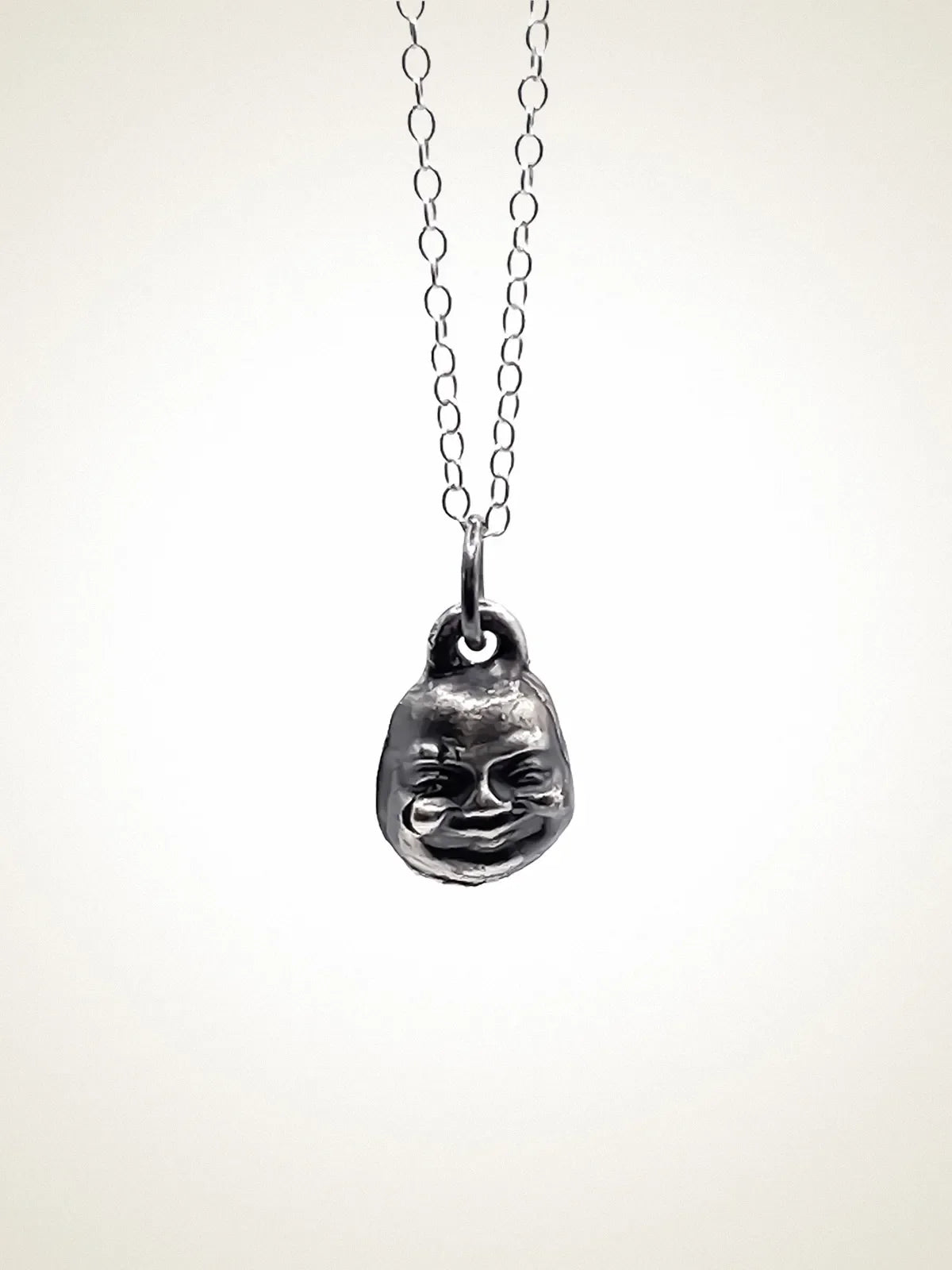 Premium Small Buddha Face Necklace handmade in premium metal, peaceful pendant, worn view