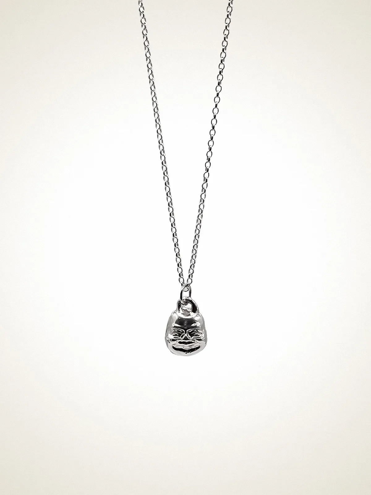 Handcrafted Small Buddha Face Necklace premium Patina jewelry, tranquil design, product shot