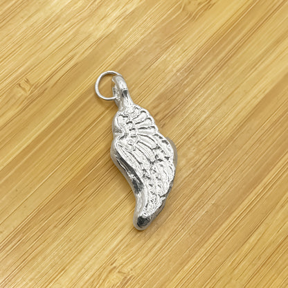 Close-up of Angel Wing Pendant with detailed feather texture, guardian 11:11 gold or silver free shipping