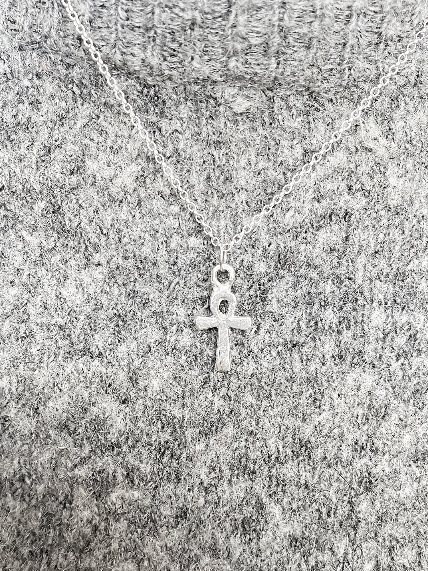 Ankh Pendant layered over textured grey knit, silver or gold.  Egyptian African