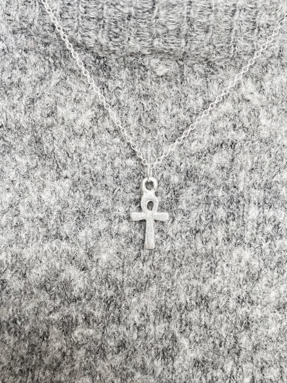 Ankh Pendant layered over textured grey knit, silver or gold.  Egyptian African