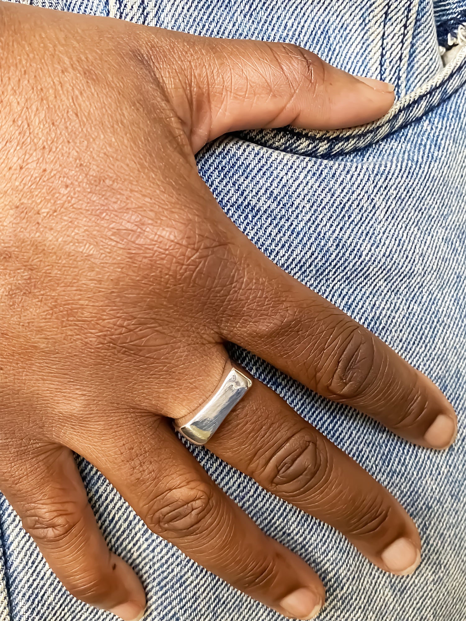 Asymmetric Grace Bow Ring unique gold and silver rings free shipping worn on a hand with denim jeans