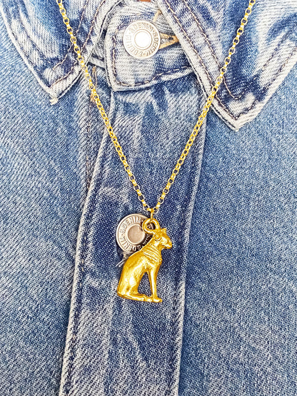 Handmade gold Bast Cat Pendant on denim jacket, featuring Egypt’s adored feline goddess. MOCA Jewellery, free shipping.