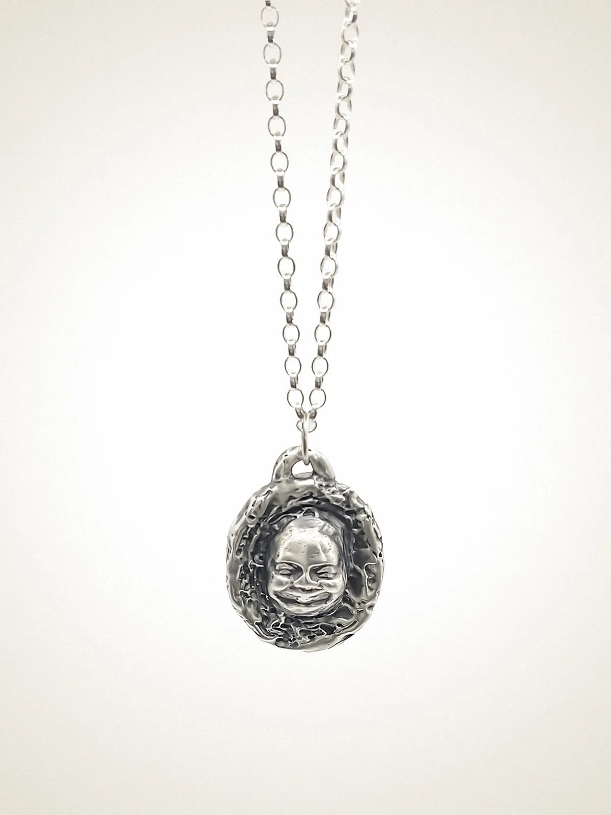 Buddha Face Necklace designer necklace in 18ct Gold Vermeil, serene face, side view