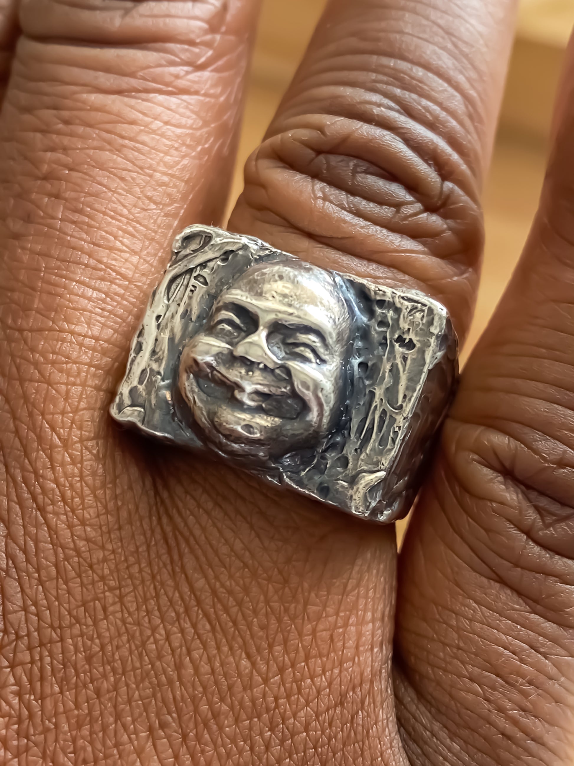 Golden-toned Buddha Signet Ring shown worn on hand - peaceful statement piece, oxidised gold or silver, free shipping