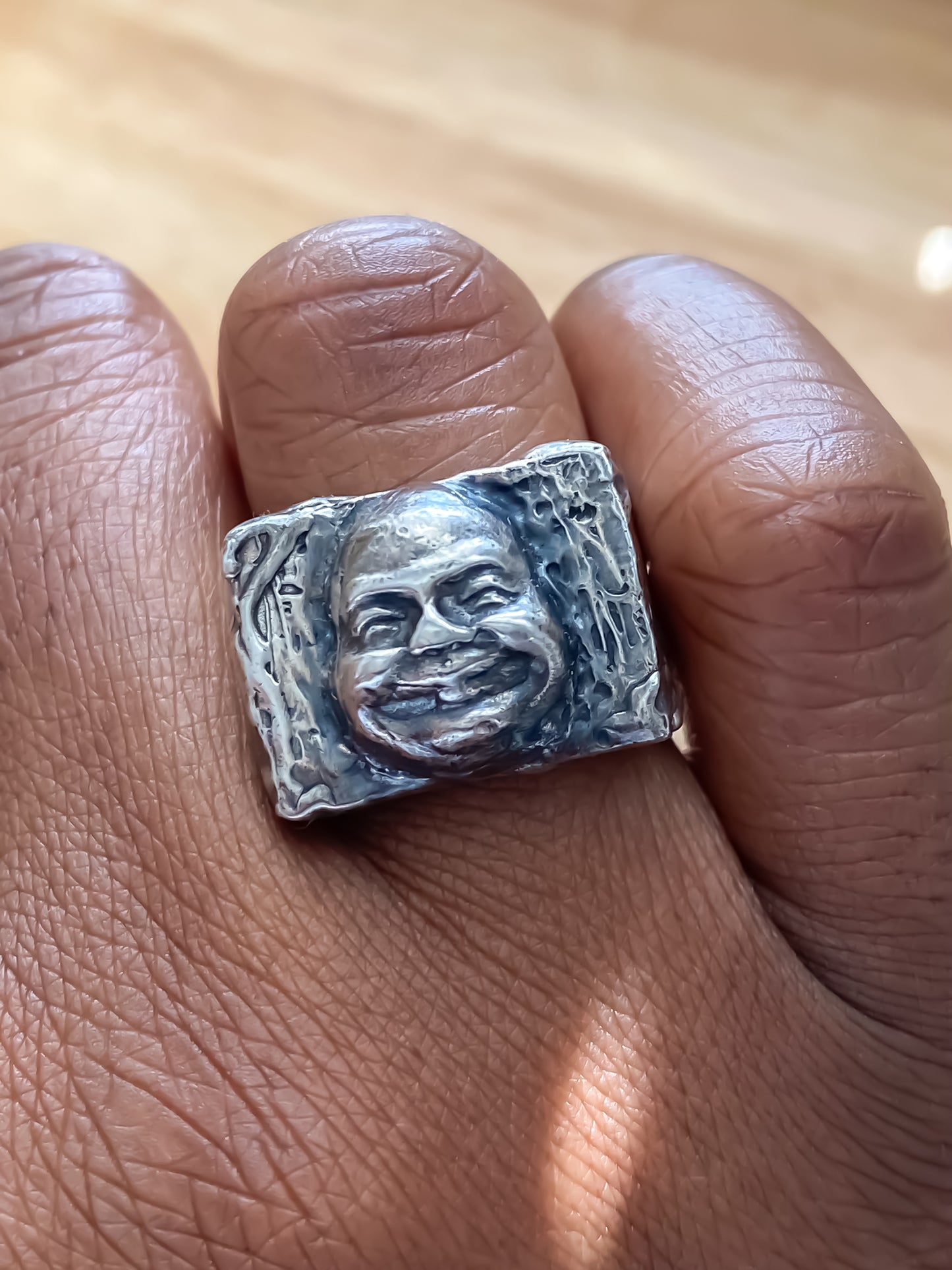 Buddha Signet Ring worn on finger profile view - peaceful statement piece, oxidised gold or silver, free shipping