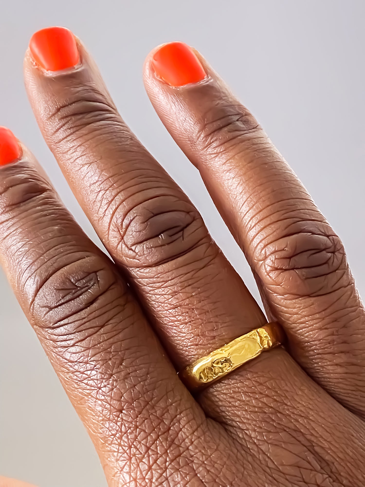 Fine gold band ring with organic hammered detail from MOCA Jewellery's Darling collection.