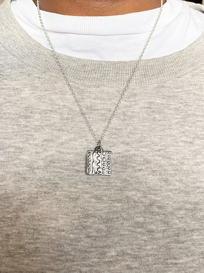 Dotty Pendant worn by model in soft light - textured, square happy buddha, oxidised organic texture gold or silver free shipping