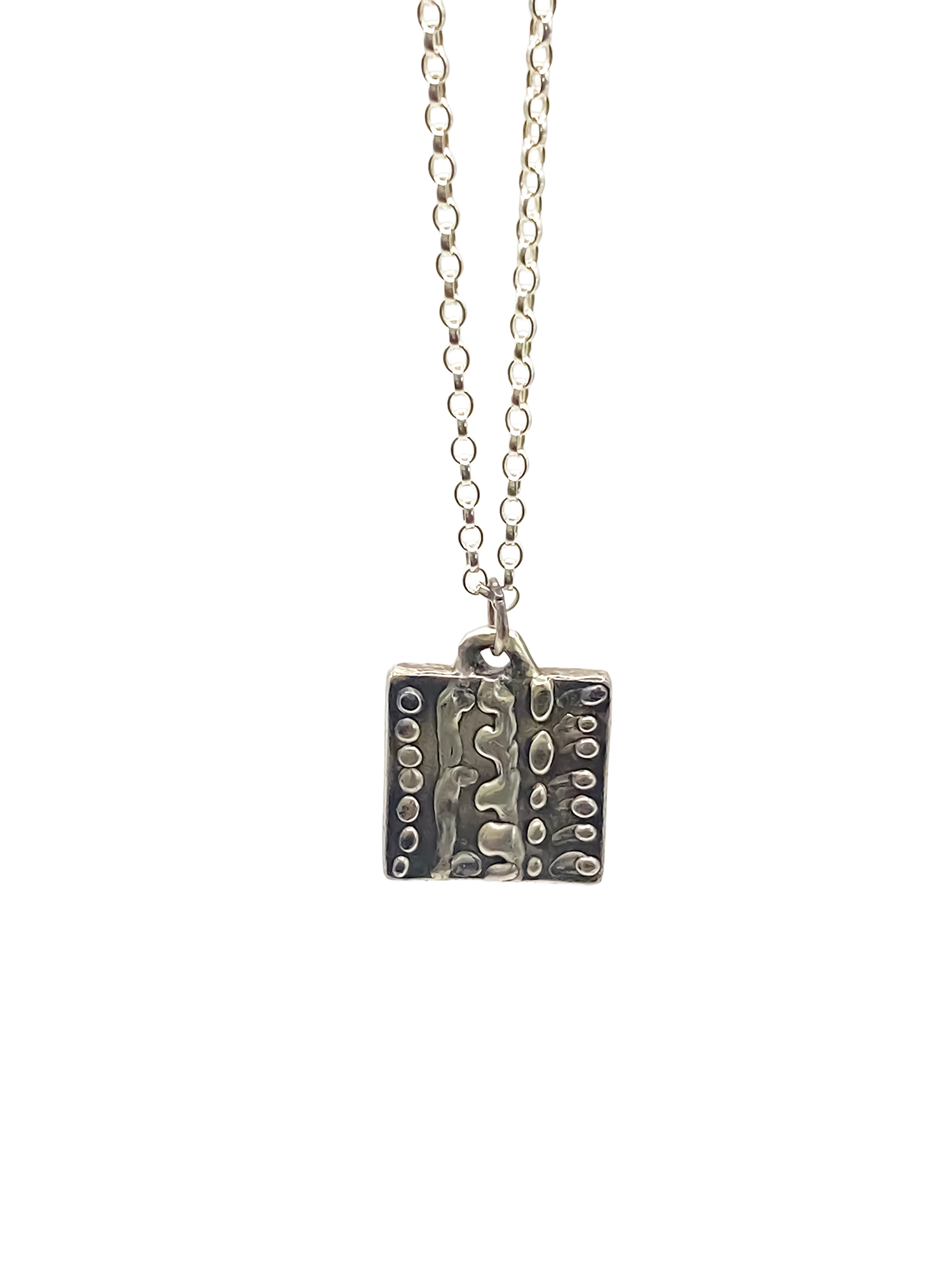 Close-up studio shot of Dotty Pendant in silver - textured, square happy buddha, oxidised organic texture gold or silver free shipping